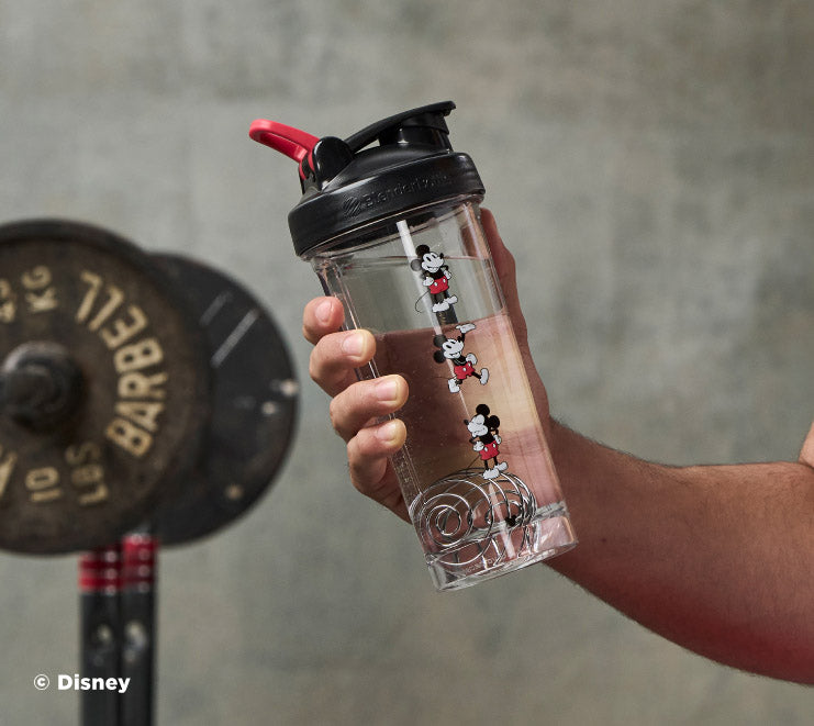 pro-series-g8 Mickey_Mouse_Protein_Shaker_Bottle_Being_Held_In_the_Gym.jpg